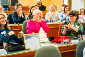 Jo Arbon Hollistic Hound Winner reaction to winning PIF's Innovation of the Year Award 2024. Hands on her face in suprise at the Business of Pets Conference 2024