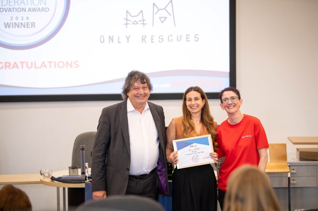 Image of PIF CEO and Worldpay prsenting the Innovation of the year award to Tara from Only Rescues